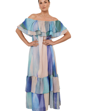 Lady in off shoulder dress in blue patter