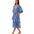 Woman wearing a blue floral dress on a transparent background