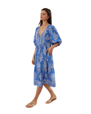 Woman wearing a blue floral dress on a transparent background