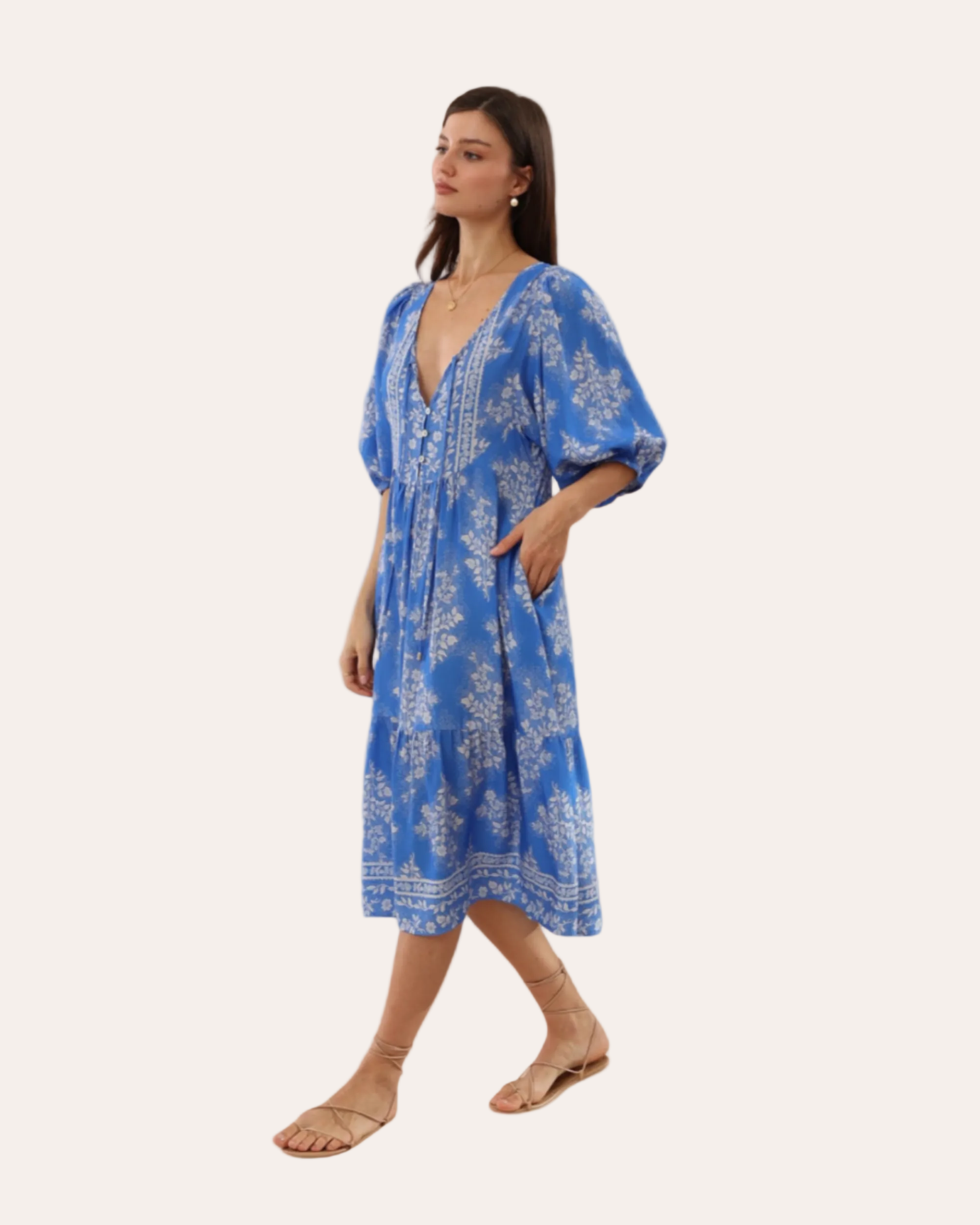 Woman wearing a blue floral dress on a transparent background