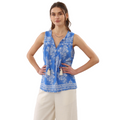 Woman wearing a blue patterned top and beige pants on a transparent background