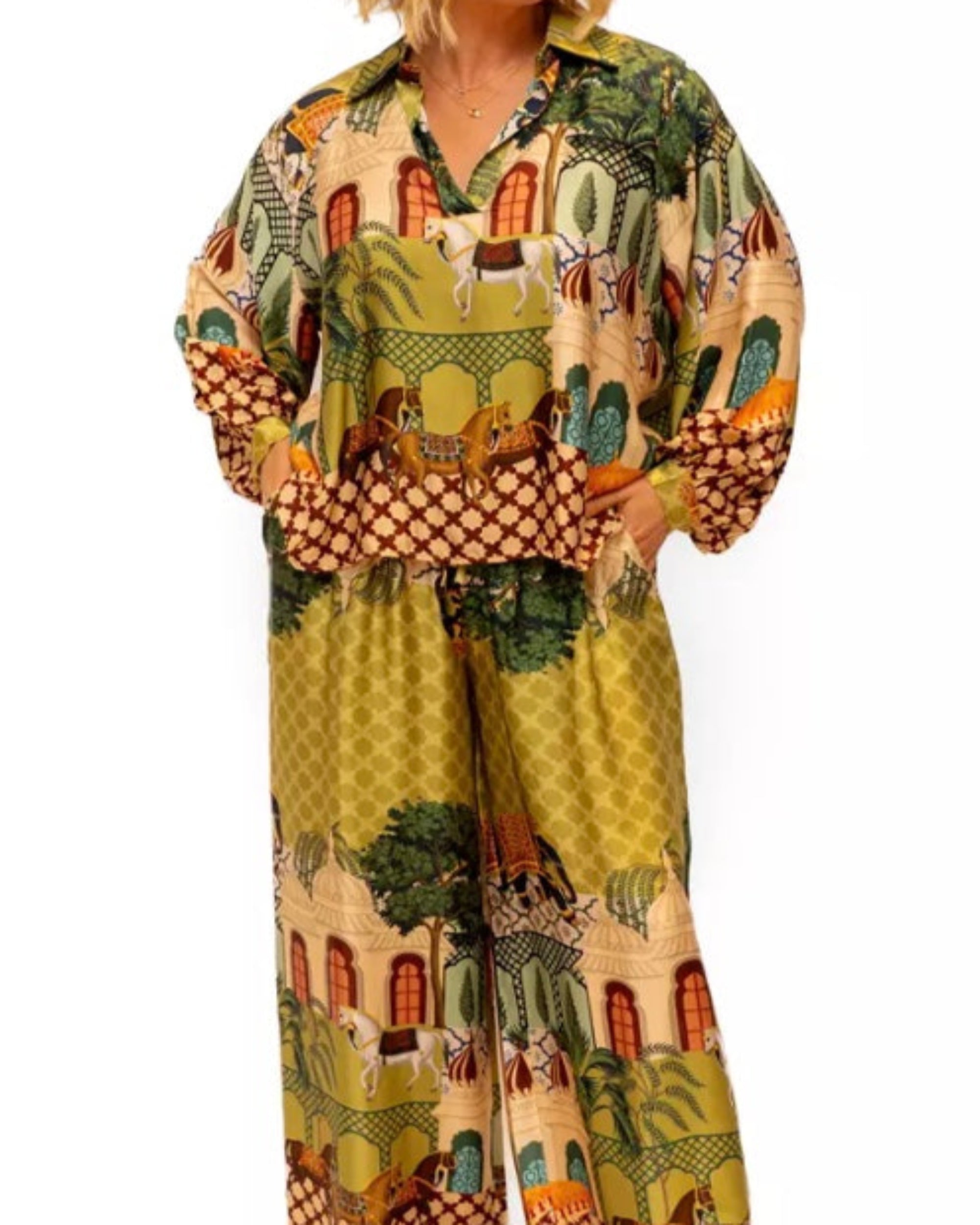 Woman wearing a colorful patterned outfit on a white background