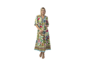 Woman wearing a colorful floral dress on a white background